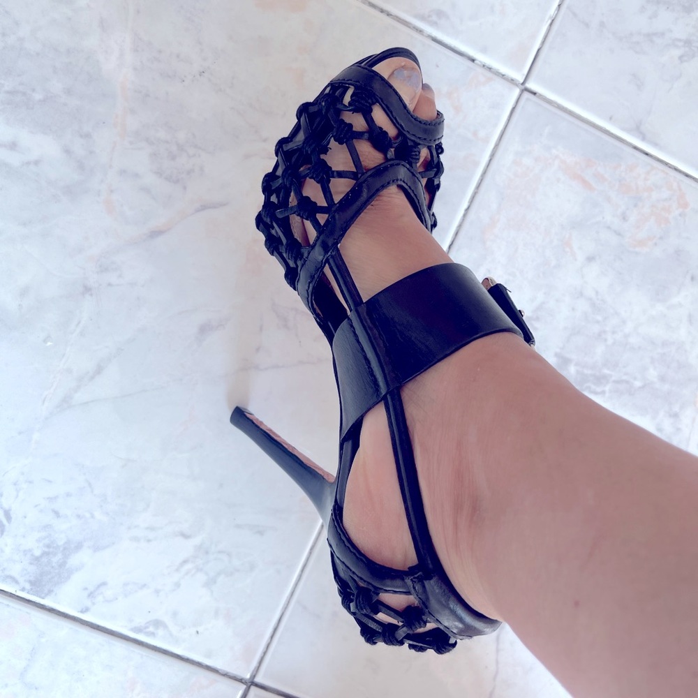 Black strapped shoes with 4 inch hill, about 3/4 inch patting at the front